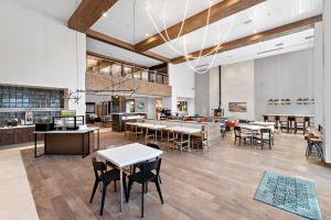 a lobby with tables and chairs in a building at Hampton Inn Big Bear Lake in Big Bear Lake