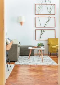 a living room with a couch and a table at Historic Old Town Home in Budapest