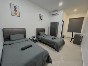 Postel nebo postele na pokoji v ubytování Elonna Homestay