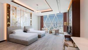 Vuode tai vuoteita majoituspaikassa Velero Hotel Doha Lusail