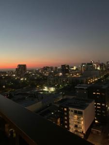 a view of a city skyline at night at CityNest Iconic View - Free Parking-Gym-Pool-BBQ in Adelaide