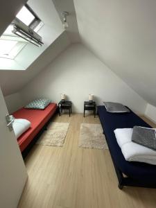 En eller flere senge i et værelse på maison de ville en centre ville cany-barville