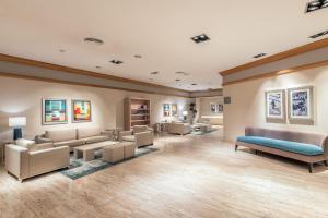 a large waiting room with couches and chairs at Sesimbra Oceanfront Hotel - Preferred Hotels and Resorts in Sesimbra