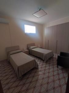 מיטה או מיטות בחדר ב-Casa Giulia