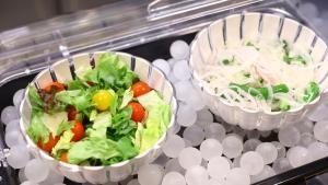 two bowls of lettuce and vegetables on a shelf at Onyado Nono Sendai Natural Hot Spring in Sendai