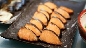 a bunch of food on a black plate at Onyado Nono Sendai Natural Hot Spring in Sendai