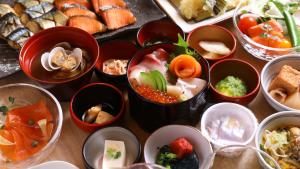 a bunch of bowls filled with different types of food at Onyado Nono Sendai Natural Hot Spring in Sendai