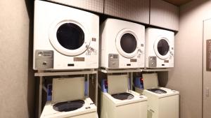 a row of washers and dryers in a room at Onyado Nono Sendai Natural Hot Spring in Sendai