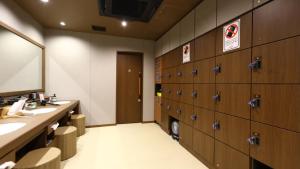a bathroom with two sinks and a mirror at Onyado Nono Sendai Natural Hot Spring in Sendai