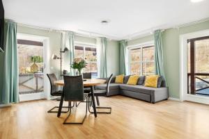 a living room with a couch and a table at Flåmsbrygga Apartments in Flåm