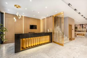 a lobby with a reception desk and a television at Hotel Bristol in Istanbul