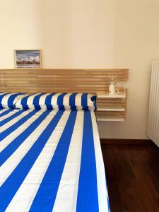 a row of bowling lanes with blue and white stripes at InLoco Beach in Fano