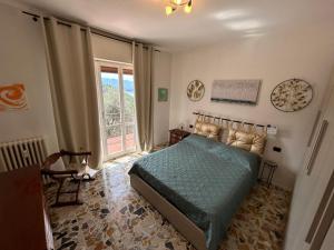 a bedroom with a bed and a large window at Dolce Vita - Fantastic view -Free Wi-fi & late check-out in Perledo