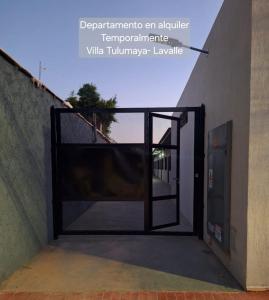 an open door to a building with a gate at Departamento en Lavalle Mendoza in General Lavalle