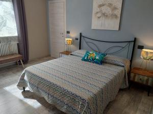 Posteľ alebo postele v izbe v ubytovaní B&B Cascina Grattinera
