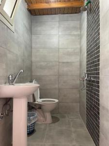 a bathroom with a sink and a toilet at Auski Hostel Dahab in Dahab