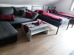 a living room with a couch and a coffee table at Ferienwohnung Schöner in Oberharmersbach