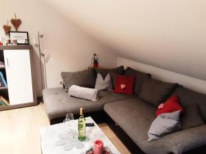 a living room with a couch and a table at Ferienwohnung Schöner in Oberharmersbach