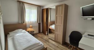 Postel nebo postele na pokoji v ubytování Pension Seeblick