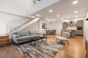 a living room with a couch and a table at I Loft Santiago by Upper Luxury Housing in Santiago de Compostela +82 photos