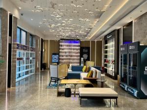 a store lobby with a blue couch and a table at Tuke China Hotel Shanghai Hongqiao Airport in Shanghai