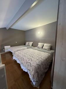 a bedroom with two beds in a room at Rêve de plage in Camiers