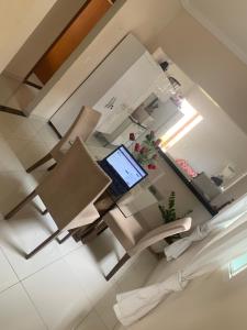 an overhead view of a office with a laptop on a table at Casa in Araxá