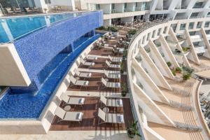 an overhead view of a swimming pool on a building at Sesimbra Oceanfront Hotel - Preferred Hotels and Resorts in Sesimbra