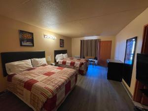 Postel nebo postele na pokoji v ubytování Motel St-Eustache