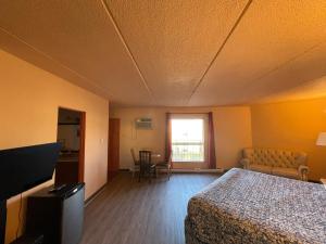 Postel nebo postele na pokoji v ubytování Motel St-Eustache