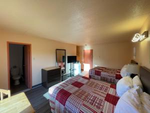 Postel nebo postele na pokoji v ubytování Motel St-Eustache