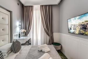 Uma TV ou centro de entretenimento em Rome55 - Piazza di Spagna