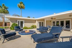 a patio with chairs and a fire pit at Scottsdale - 4826 N 69th St in Scottsdale
