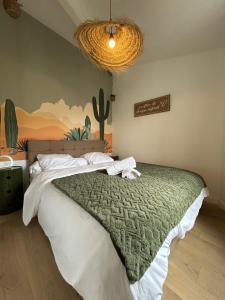 Katil atau katil-katil dalam bilik di Arizona Dream - T1 Bis Climatisé 4p WiFi