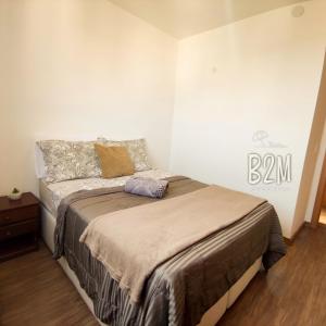 Ένα ή περισσότερα κρεβάτια σε δωμάτιο στο Vila Açoriana Confort club, pé na areia