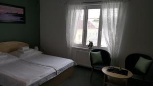 Katil atau katil-katil dalam bilik di Penzion Villa Rozárka