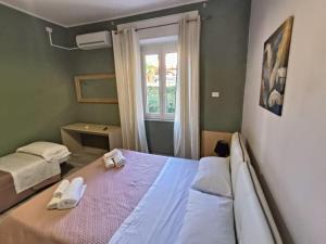 Postel nebo postele na pokoji v ubytování A DUE PASSI DALLA VALLE DEI TEMPLI