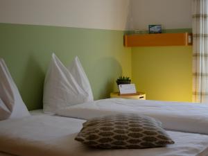 Postel nebo postele na pokoji v ubytování Haus Gutenberg