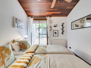 a bedroom with a large bed and a window at Xauxa in Sant Pere de Vilamajor
