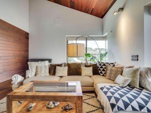 a living room with a couch and a coffee table at Xauxa in Sant Pere de Vilamajor