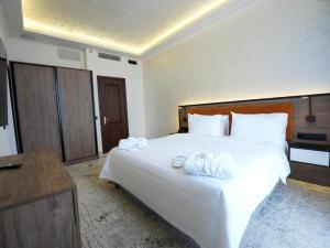 Postel nebo postele na pokoji v ubytování Eighty Eight Deluxe Hotel & Spa