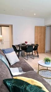 a living room with a couch and a table at Charming 1-Bed Apartment in Leeds in Leeds