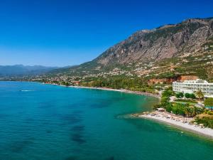 an aerial view of a beach with a mountain at Verga Beachside Getaway with Panoramic Seaviews in Almirón