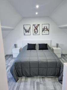 A bed or beds in a room at Gîte moderne, tout confort avec extérieur
