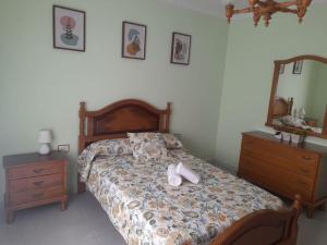 Ένα ή περισσότερα κρεβάτια σε δωμάτιο στο Apartamento Sanchola +10 φωτογραφίες