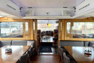 a dining car of a train with tables and chairs at Eventschiff Grosser Michel in Hamburg