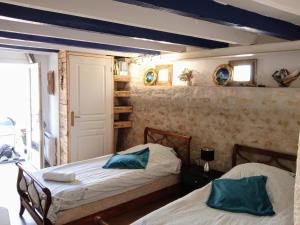 Postel nebo postele na pokoji v ubytování studio coconning proche de Fouras