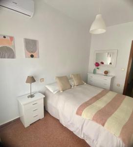 Postel nebo postele na pokoji v ubytování Vera Apartment, acogedor y tranquilo en el corazón de la ciudad