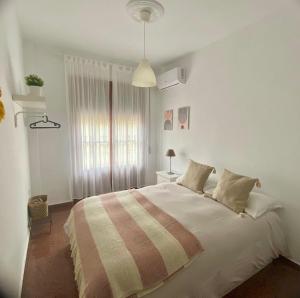 Postel nebo postele na pokoji v ubytování Vera Apartment, acogedor y tranquilo en el corazón de la ciudad