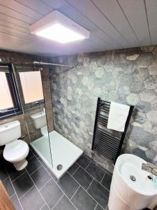 a bathroom with a toilet and a sink at Beaver 1 HuntersMoon-warminster-Wiltshire in Warminster